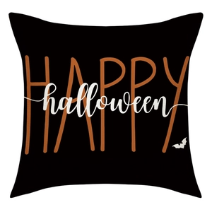 Detail of linen Halloween pillow cover with Happy Halloween print and bat motif