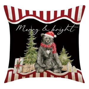 Close-up of rustic cotton linen cushion cover with watercolor Christmas bear and tree design