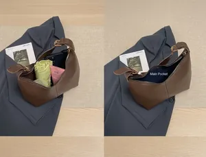 Detail view of the brown leather bag interior showing capacity for daily essentials