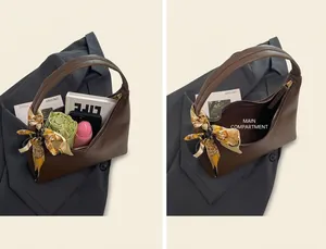 Detailed interior of hobo bag showing large capacity with main pocket and daily items