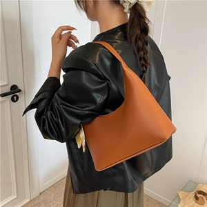 Chic orange-brown faux leather hobo shoulder bag with stylish decorative silk scarf