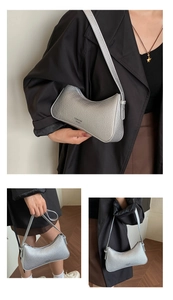 Detailed view of silver lychee texture hobo bag with sleek TIANYUN YICAI branding
