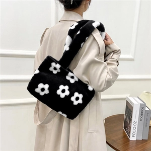 Minimalist black plush shoulder bag with white flower patterns and wide strap