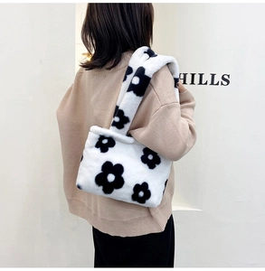 Detail view of plush floral tote bag showing the soft faux fur texture and shoulder fit
