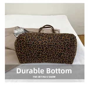 Detail showing the wear-resistant base of this large leopard print canvas tote bag