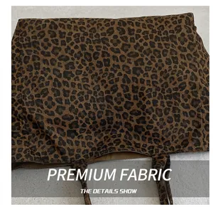 Close-up of leopard print canvas tote bag showing high-quality woven fabric texture