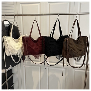 Detail showing four crochet fringe tote bags in beige, burgundy, black, and brown colors