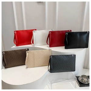 Detailed display of envelopes clutches in seven colors with wrist straps and zippers
