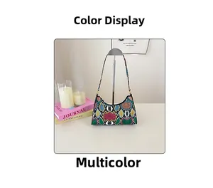 Detail shot of multicolor faux python pattern texture on a crescent shoulder bag