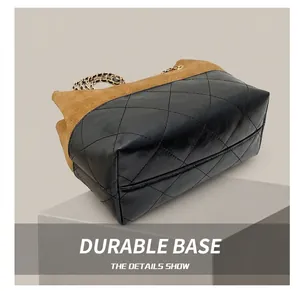 Detail shot of the quilted leather base and premium suede stitching on the tote bag