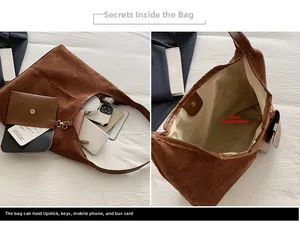 Macro detail of large brown suede shoulder bag showing interior storage and coin purse
