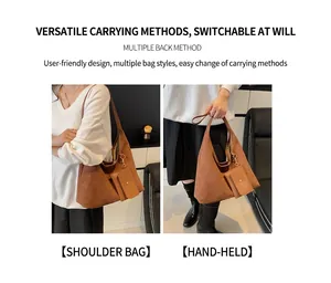 Detail of a brown suede tote bag with a small matching pouch for versatile daily use