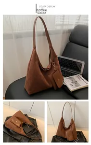 Detail view of coffee suede tote bag with detachable pouch and golden hardware