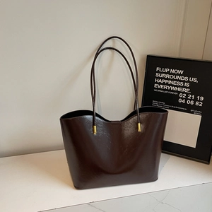 Minimalist large dark brown tote bag in glossy faux leather with gold hardware detail