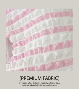 Macro detail of pink and white striped bubble fabric with textured seersucker finish