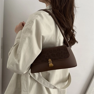 Vintage brown shoulder bag with leopard print flap and golden clasp for women