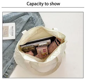 Spacious interior of a beige tote bag showing large capacity for essentials
