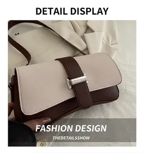 Detailansicht der Vintage-Baguette-Tasche mit zweifarbiger Lederoptik und silbernem Verschluss