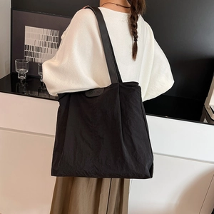 Large capacity black nylon tote bag for women with leather trim for daily commuting