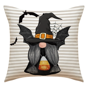 Detail of Halloween gnome pillow cover with bat wings and candy corn pattern