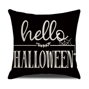 Close-up of linen Halloween pillow cover with Hello Halloween text and spider web detail