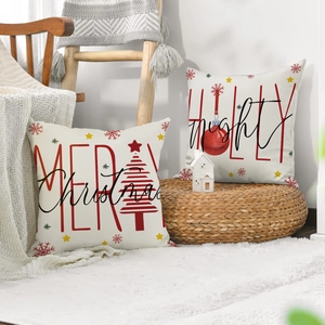 Close-up of festive Christmas pillow covers with Merry Christmas prints on linen fabric