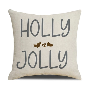 Detail von Holly Jolly Text und Stechpalmen-Druck auf Kissenbezug aus Baumwollleinen