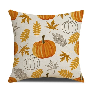 Detail of linen pillow cover showing autumn pumpkin print and textured fabric weave