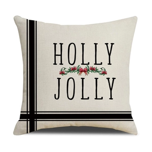 Macro detail of Christmas pillowcase with HOLLY JOLLY print and linen fabric texture