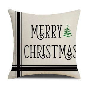 Close-up of beige cotton linen Christmas pillowcase with Merry Christmas text and tree