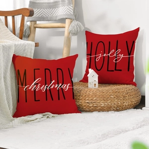 Set of two red Christmas throw pillows with Merry Christmas and Holly Jolly typography