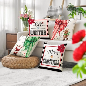 Set of four Christmas linen pillow covers with winter reindeer and Santa Claus designs