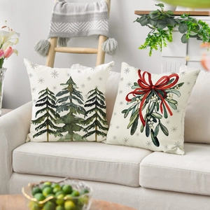 Set of two Christmas throw pillow covers with trees and mistletoe for home decor