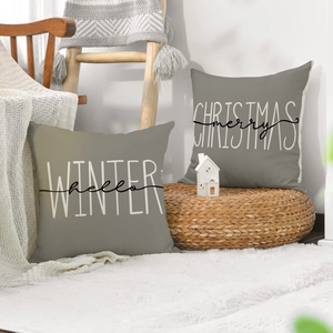 Detail of grey linen Christmas pillow covers featuring winter and holiday typography