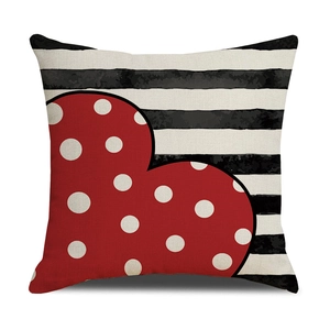 Square cushion cover with red polka dot heart on black and white striped background
