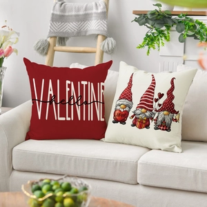Detail of Valentine gnomes and letter print pillow covers on a cozy sofa setting