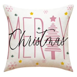 Detailed close-up of Christmas linen pillowcase with pink Merry Christmas festive print