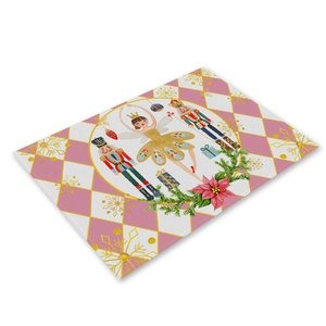 Detail of Christmas linen placemat featuring nutcracker and ballerina holiday print