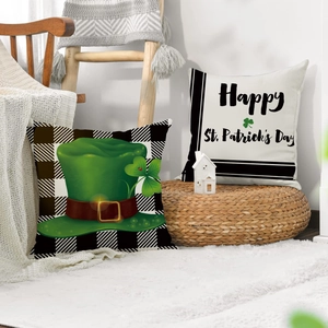 Linen St. Patrick's Day pillow covers with buffalo plaid and clover on a cozy chair