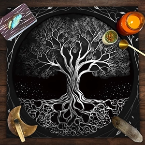 Macro detail of black velvet altar cloth featuring white Tree of Life design on wood table