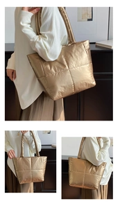 Detailed view of champagne gold quilted padded tote bag with metallic glossy finish