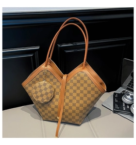 Detail of checkered leather bucket bag with V-cut top design and circular mini pouch