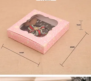 Pink Christmas gift box dimensions with snowflake pattern and festive hair accessories