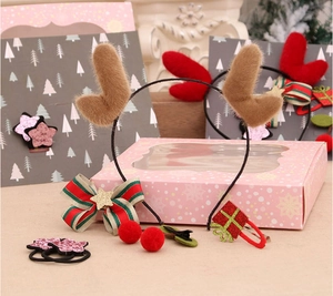 Christmas hair accessories set with reindeer antlers and bows in a gift display box