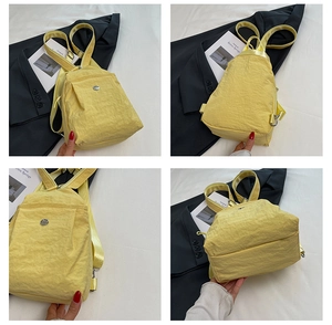 Detailed multi-angle views of yellow nylon crossbody backpack with metallic logo and zipper