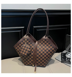 Detail of checkered bucket bag with matching round coin purse and V-shaped cut design