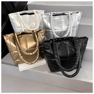 Quilted down tote bags in metallic finishes with stylish scrunchie handles on steps