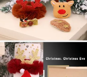 Close-up of festive Christmas hair accessories including reindeer scrunchies and star clips