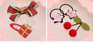 Close-up of kids Christmas hair accessories set with bows and glitter star clips