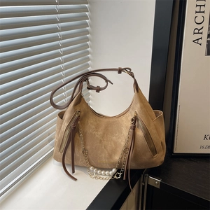 Brown suede underarm tote bag with pearl chain detail and decorative metal zippers